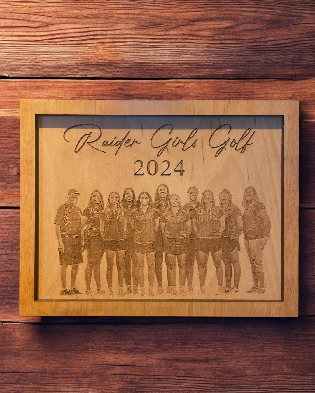 Engraved wooden plaque commemorating a girls golf team